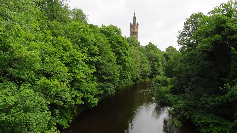 The River Kelvin with the University of Glasgow tower above the trees